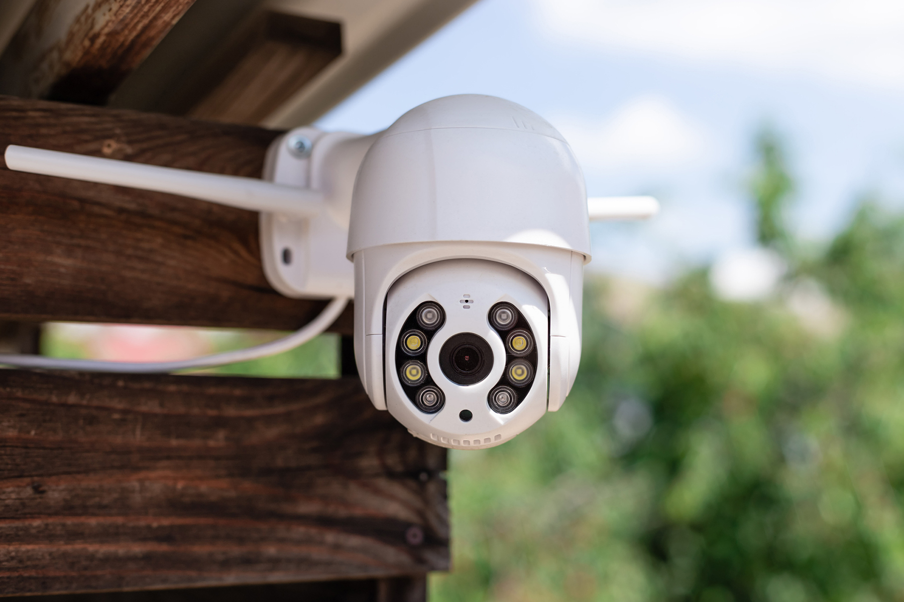 security camera mounted to fence boards