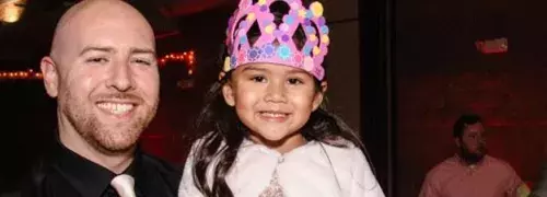 dad and daughter in a princess crown at a dance