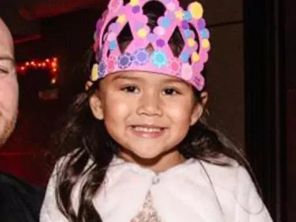 dad and daughter in a princess crown at a dance